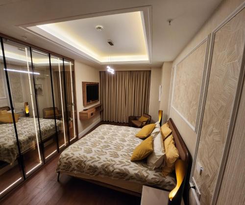a hotel room with a bed and a mirror at High Residence -Monthly rental- Mall of Istanbul in Istanbul