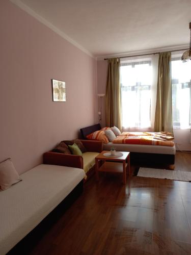 a living room with a couch and a table at Apartmán Maršík in Náchod