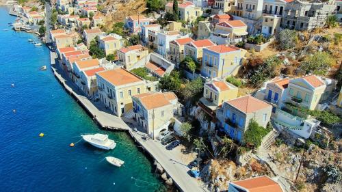 an aerial view of a town next to the water at Pitini Sevasti house in Symi