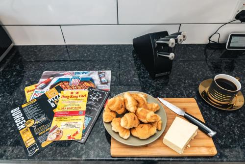 a plate of food on a table with a plate of food at 3 Bedrooms house ideal for long Stays! in Southampton