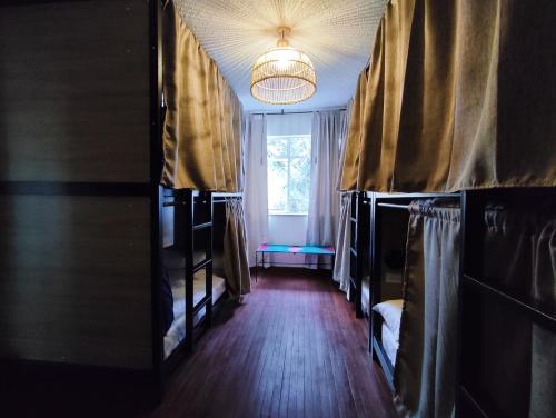 a room with bunk beds and a window at Trip Monkey Chapinero in Bogotá