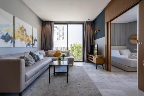 a living room with a couch and a bed at super appartement with parking c4 in Casablanca
