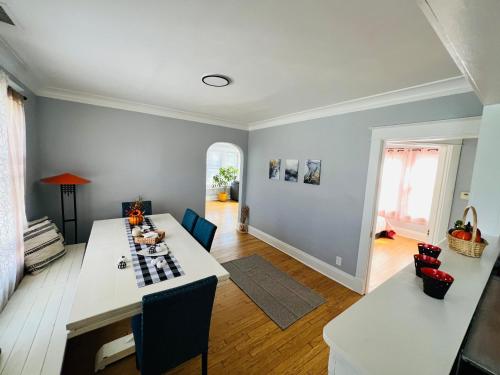 a kitchen and living room with a table and chairs at Dale Ave second floor in Richmond Heights