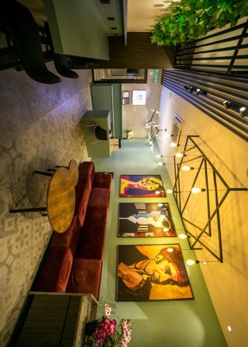 an overhead view of a room with paintings on the wall at Eureka Hotel Penang in Bayan Lepas