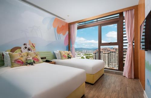 Postel nebo postele na pokoji v ubytování Mangrove Tree Resort World Sanya Bay -Elader Palm Tower