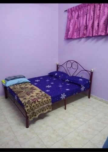 Ένα ή περισσότερα κρεβάτια σε δωμάτιο στο G4 Flats Family Homestay