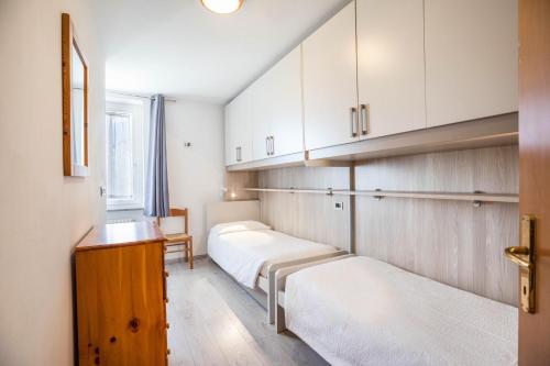 Un pat sau paturi într-o cameră la Casa Penasa appartamento 2