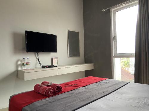 Кровать или кровати в номере RedDoorz near RSUD Margono Purwokerto 3