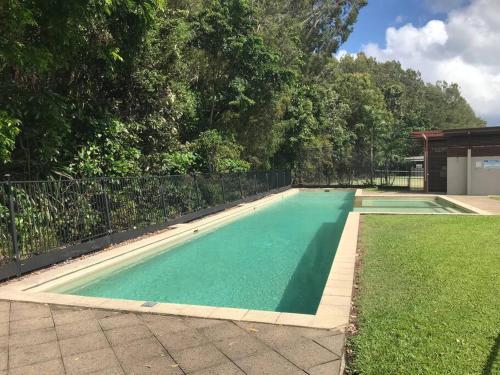 a swimming pool in the middle of a yard at Relax at Trinity Beach Getaway, Blue Lagoon, Trinity Beach in Trinity Beach