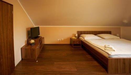 Hotel Horse Riding - Jezdecký Areál Tršiceにあるベッド