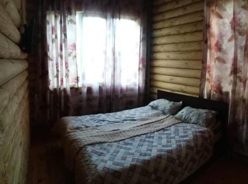 Postel nebo postele na pokoji v ubytování Guest house Ozernaya