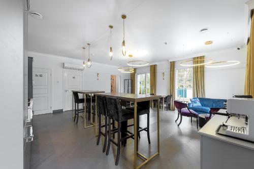 a kitchen and dining room with a table and chairs at Vilnius legends house I Best for families I Free parking in Vilnius