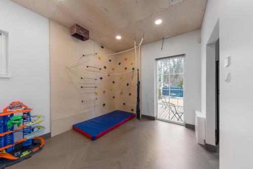 a room with a climbing wall and a rock wall at Vilnius legends house I Best for families I Free parking in Vilnius