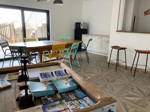 a kitchen and dining room with a table and chairs at Casa Santa Giulia in Propriano