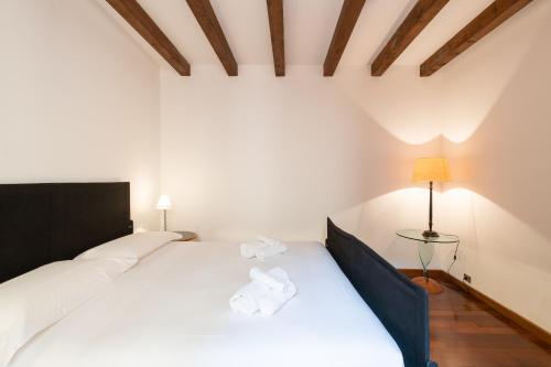 Ένα ή περισσότερα κρεβάτια σε δωμάτιο στο Civico 34 Elegant Flat