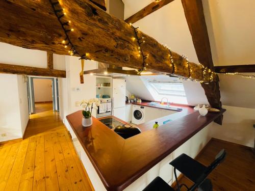 a kitchen with a wooden counter top in a room at Down Town Spacious Loft with Private Parking in Brussels