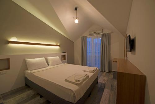 Кровать или кровати в номере GRAND EMİR HOTEL SPA