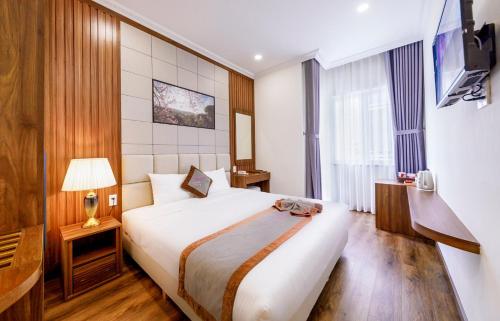 Postel nebo postele na pokoji v ubytování Wisteria Hotel