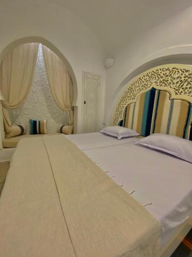 Cama o camas de una habitación en Hôtel Djerba Authentique - Au centre de Midoun