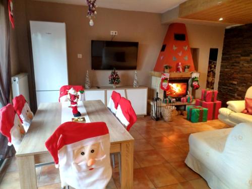a living room with a table with a santa hat on it at Jardines de Viana in Viana