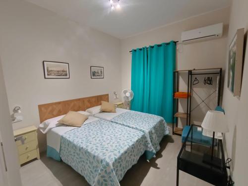 A bed or beds in a room at Centro de Sevilla