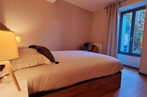 Postel nebo postele na pokoji v ubytování Le 56 Faubourg - Proche centre - Parking gratuit