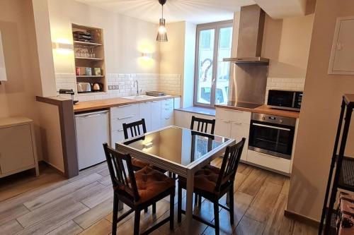 Kuchyň nebo kuchyňský kout v ubytování Le 56 Faubourg - Proche centre - Parking gratuit