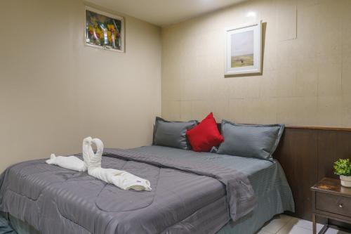 Кровать или кровати в номере CheQinn Bed Sukhumvit 4 Nana Plaza