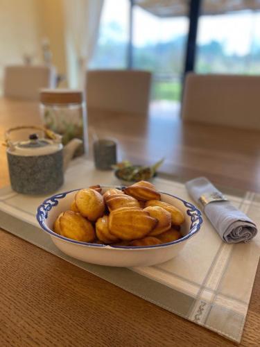 a bowl of food sitting on top of a table at Aux Coteaux d'Aussac in L Honor De Cos
