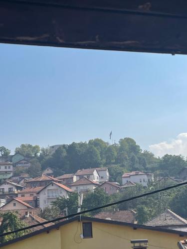 a view of a city with houses and trees at Apartman Maki in Sarajevo