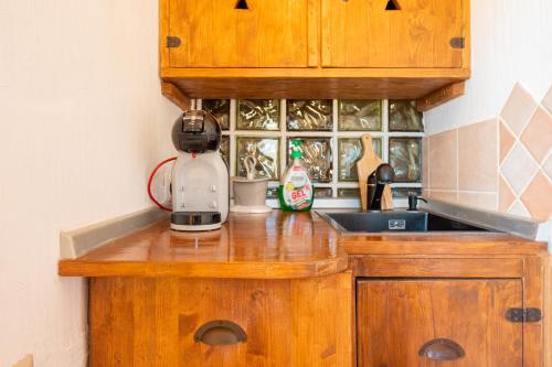 a kitchen counter with a mixer on top of it at Seahouserent in Cannigione
