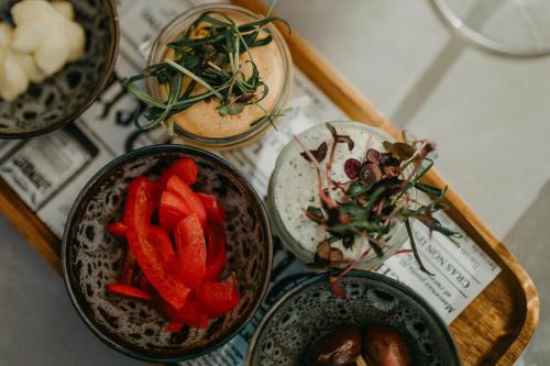 a group of bowls of food on a table at Hotel Palais26 in Villach