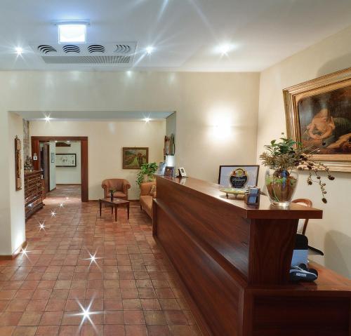 a lobby of a hospital with a reception desk at Hotel La Plumeria in Cefalù