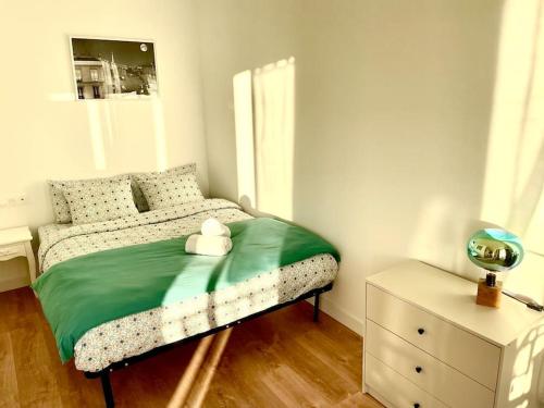 Ένα ή περισσότερα κρεβάτια σε δωμάτιο στο Appartement en résidence calme / Puteaux - La Défense