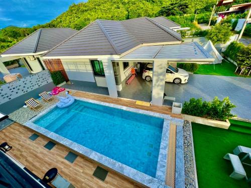 an overhead view of a house with a swimming pool at Chill at Hill Pool Villa Sattahip in Ban Tao Than