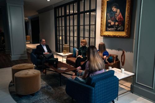 a group of people sitting in a room at Morris Inn at Notre Dame in South Bend