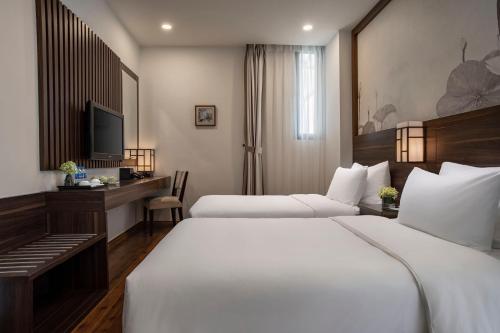 Authentic Hanoi Boutique Hotelにあるベッド
