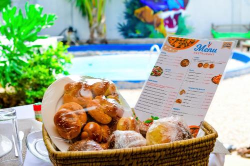 a basket filled with pastries sitting on a table at Ondo House in Nungwi