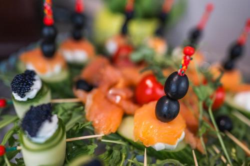 a plate of food with fruit and vegetables on it at Hotel Korsal in Korčula