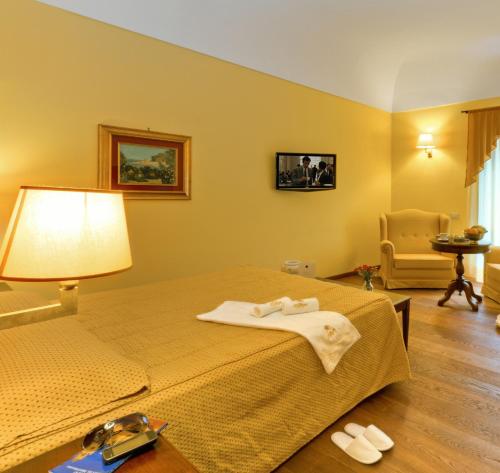 Giường trong phòng chung tại Hotel La Plumeria