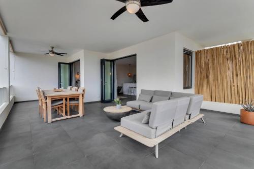 a living room with a couch and a table at Grand Windsock Bonaire in Kralendijk