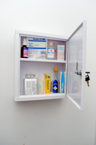 an open refrigerator door with products in it at Ondo House in Nungwi