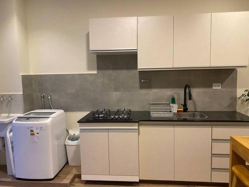 Η κουζίνα ή μικρή κουζίνα στο Americas Apartment