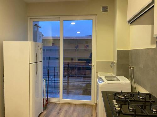 Η κουζίνα ή μικρή κουζίνα στο Americas Apartment