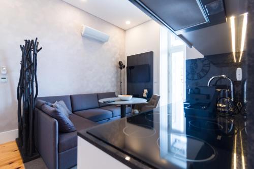 a living room with a couch and a table at ON Apartments - Lapa Deluxe in Porto