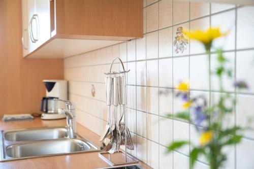 a kitchen sink with a faucet on a counter at Fortschöllhof in Castelrotto