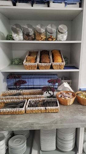 a pantry filled with lots of different types of food at Hotel Malinowski Economy in Gliwice