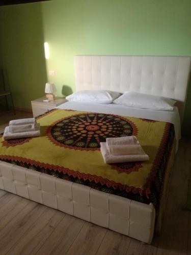 a large bed with two pillows on top of it at Il soppalco in Avola
