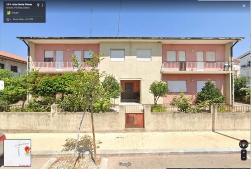 a house on the side of a street at Barros' House in Chaves