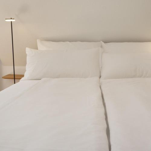 Ein Bett oder Betten in einem Zimmer der Unterkunft bellasBnB an der Jagst